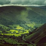 green mountains under white clouds during daytime